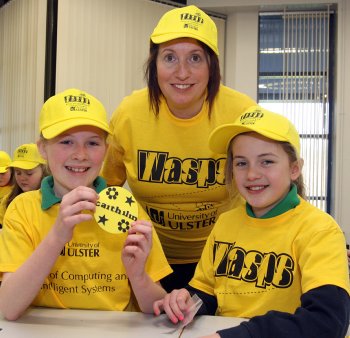 Dr Sandra Moffett, Lecturer of Computer Science at the University of Ulster, Magee ,with St.Colmcille PS pupils Caithilin Hughes and Abbie McLaughlin